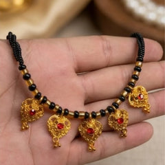 black beaded charyo with gold pendants and red stones.
