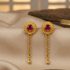 Gold earrings with red gemstones 